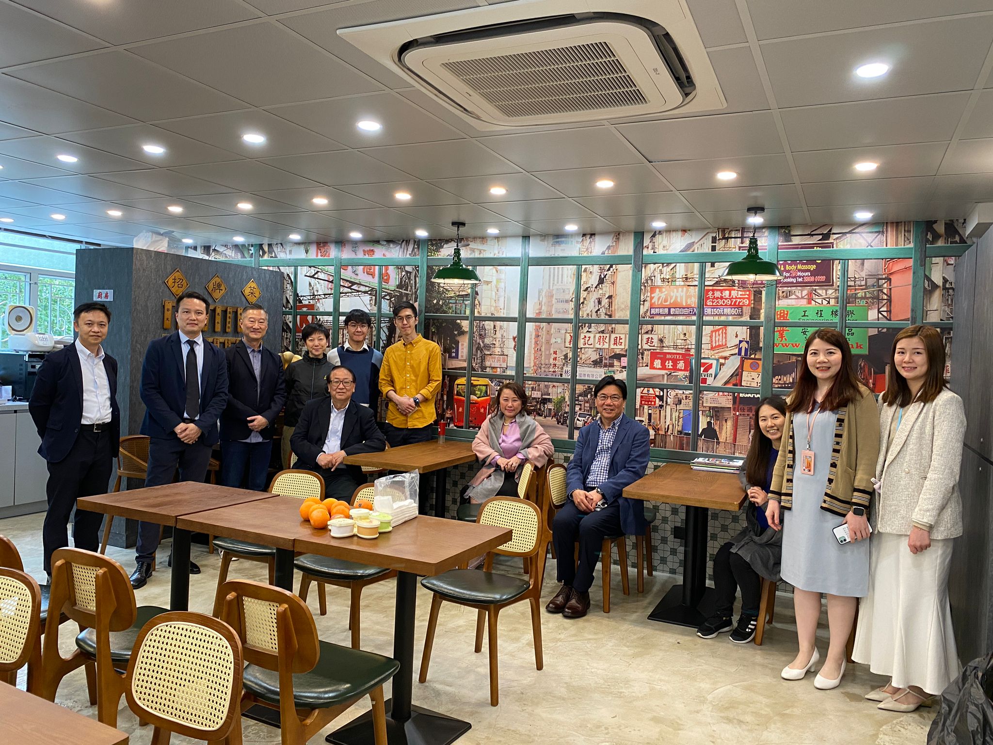 May be an image of 8 people, people standing and people sitting